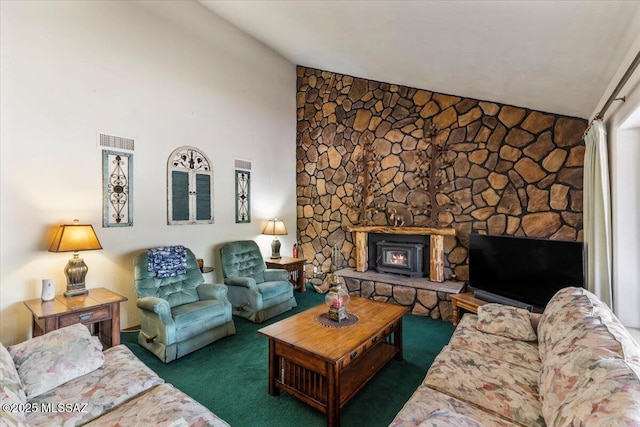 carpeted living room with visible vents and vaulted ceiling