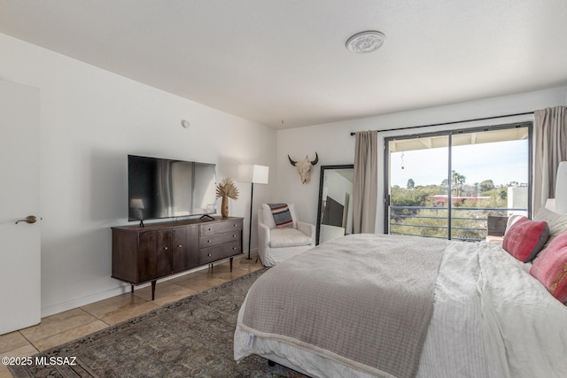 tiled bedroom featuring access to outside