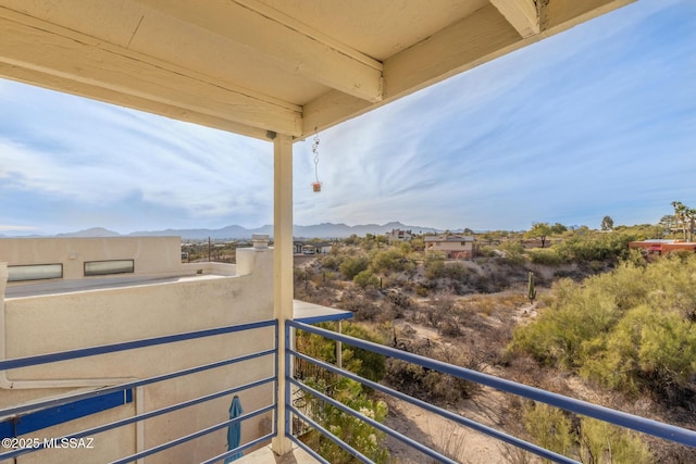 balcony featuring a mountain view