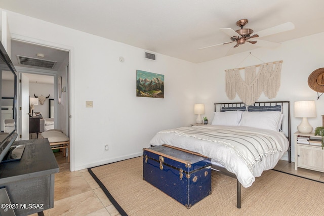 bedroom with light tile patterned floors, a ceiling fan, visible vents, and baseboards