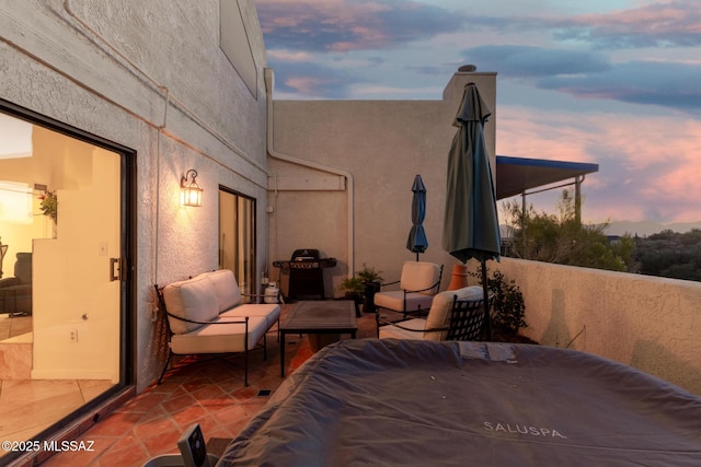 view of patio terrace at dusk