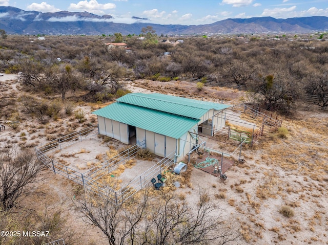 birds eye view of property featuring a mountain view