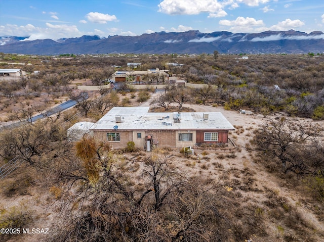 birds eye view of property featuring a mountain view