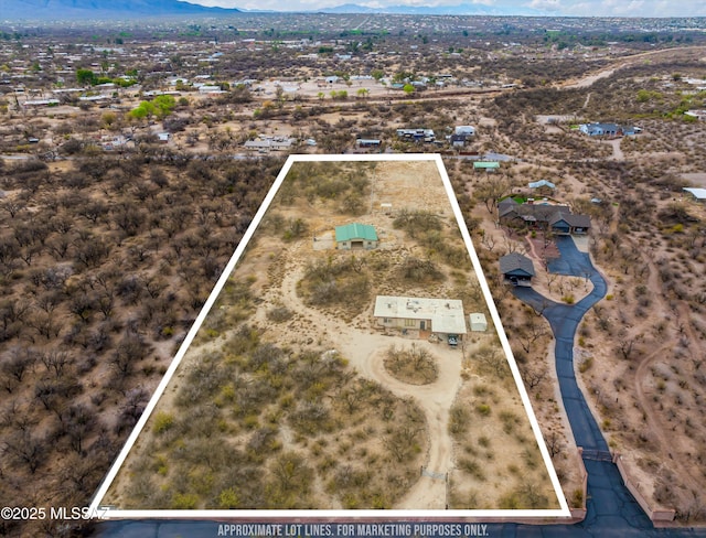 drone / aerial view featuring a mountain view