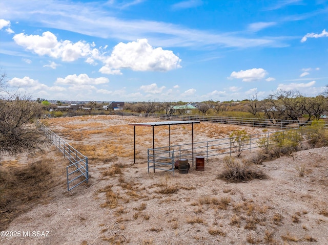 view of yard with a rural view