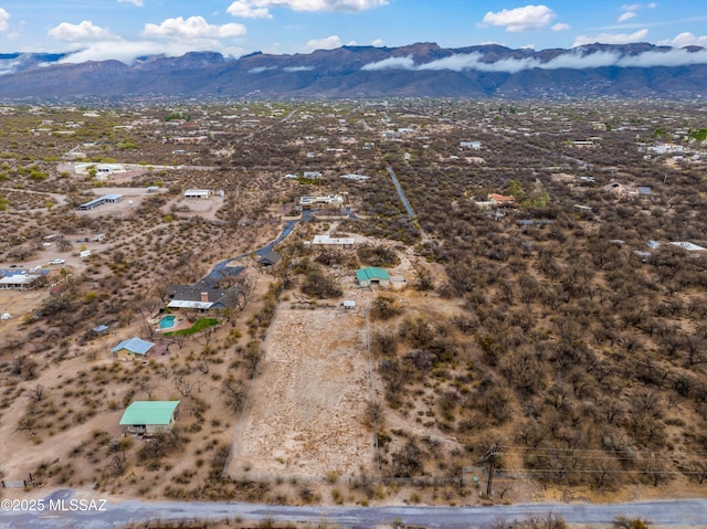 birds eye view of property with a mountain view