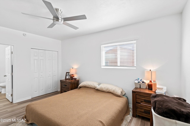 bedroom featuring light wood-type flooring, a closet, ceiling fan, and baseboards