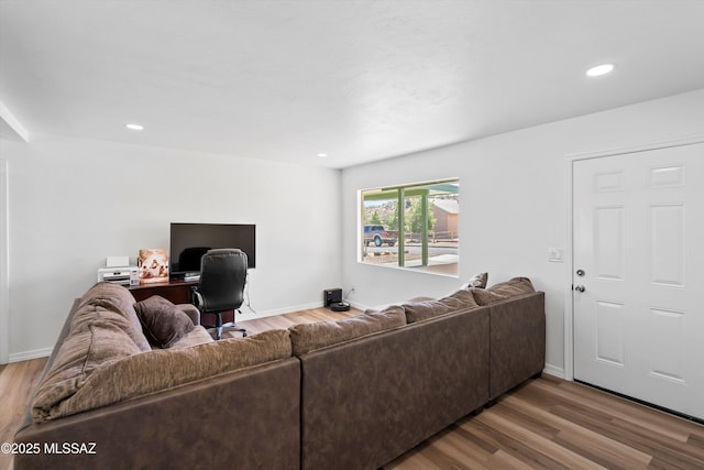 living room featuring recessed lighting, wood finished floors, and baseboards