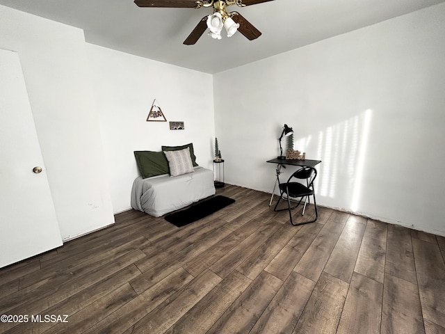 living area featuring wood finished floors and a ceiling fan