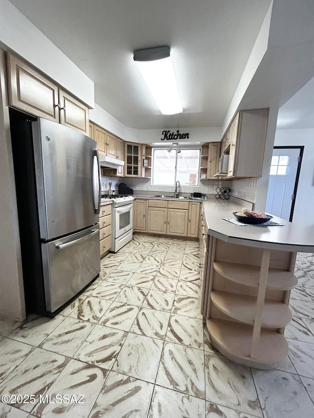 kitchen featuring open shelves, white range with gas cooktop, freestanding refrigerator, under cabinet range hood, and marble finish floor