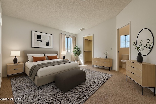 bedroom with a textured ceiling, visible vents, light carpet, vaulted ceiling, and a spacious closet