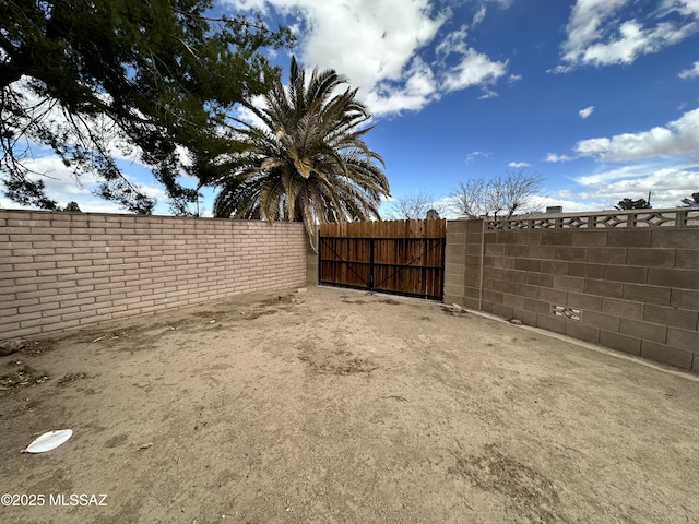 view of yard featuring a gate and fence