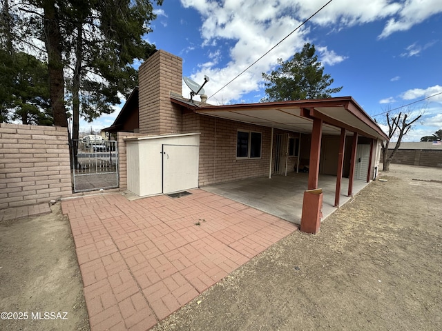 exterior space with a gate and fence