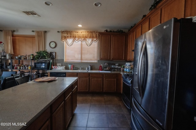 kitchen with recessed lighting, visible vents, light countertops, tile patterned floors, and black appliances