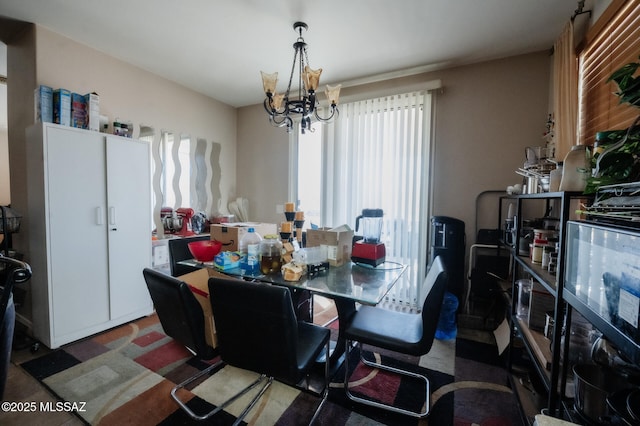 dining space with a chandelier