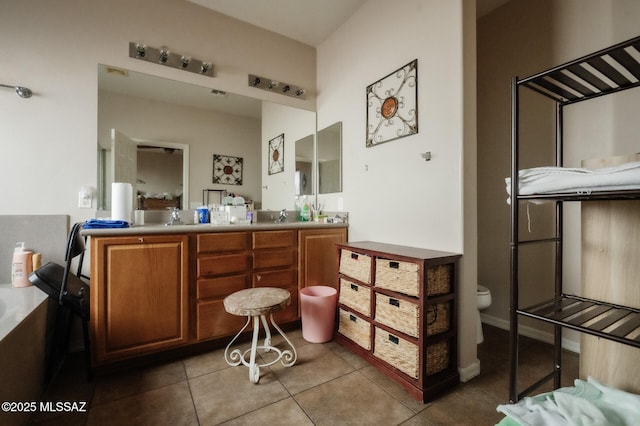 full bathroom with tile patterned flooring, a sink, toilet, and double vanity