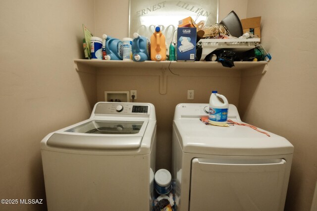 laundry area with laundry area and independent washer and dryer