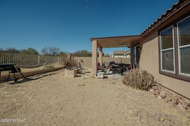 view of yard with a patio and fence