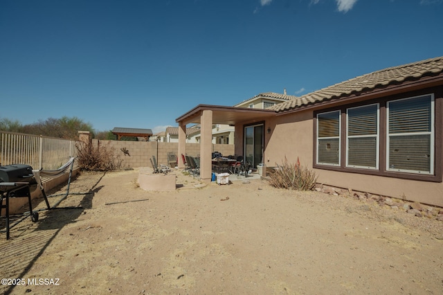 exterior space featuring a patio area and a fenced backyard