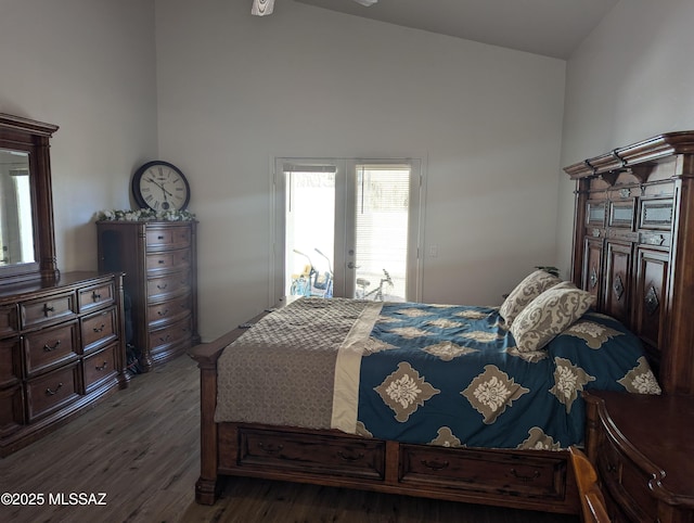 bedroom featuring wood finished floors and vaulted ceiling