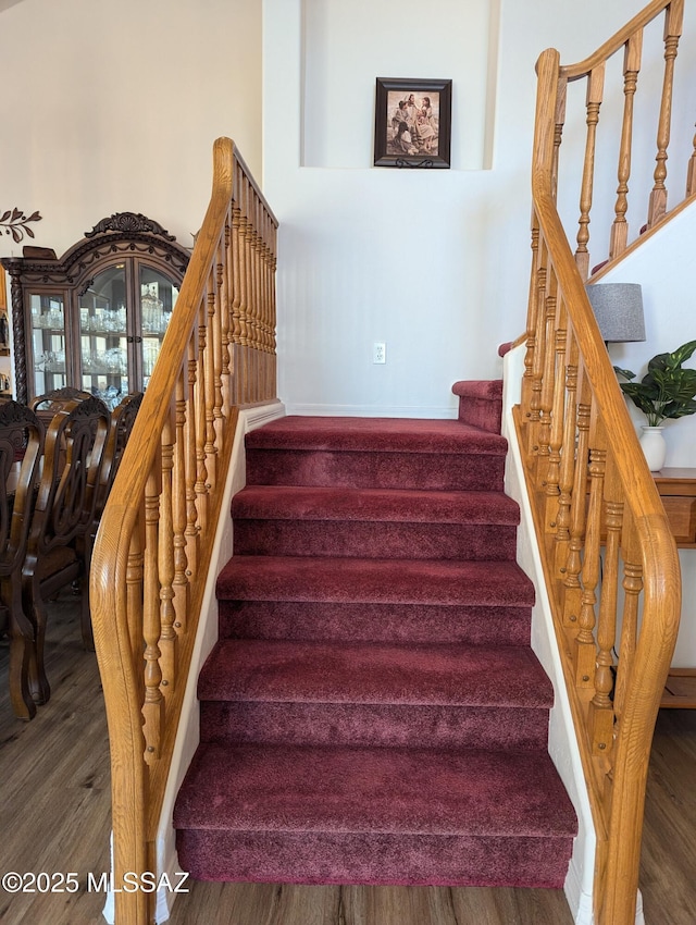 stairs with wood finished floors