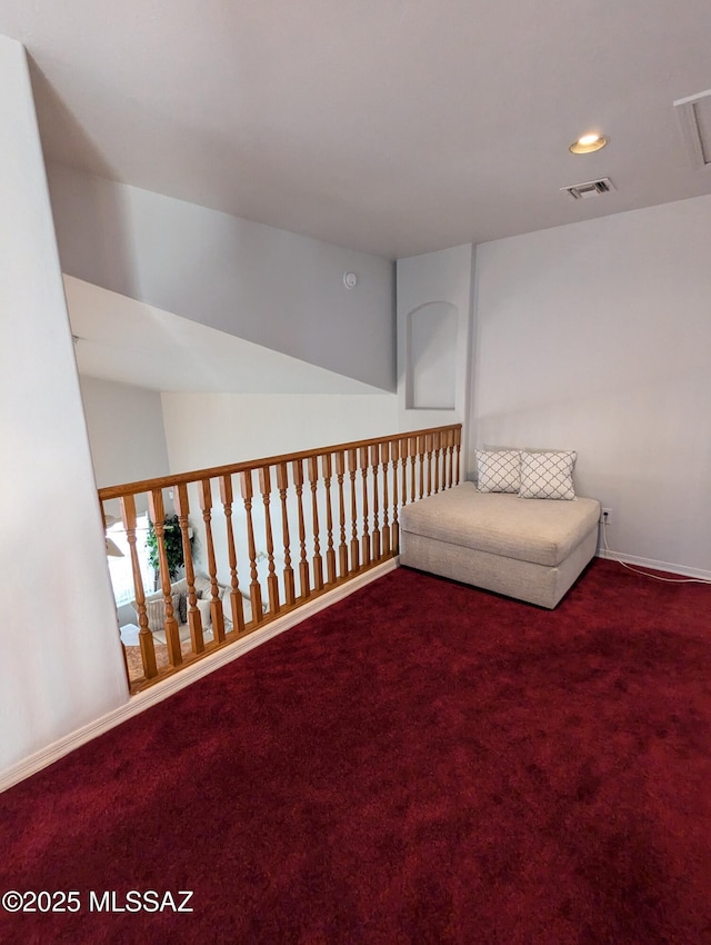 unfurnished room featuring visible vents, baseboards, and carpet