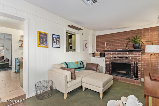 living room featuring visible vents and a fireplace