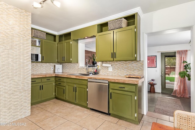 kitchen with dishwasher, light countertops, and green cabinets