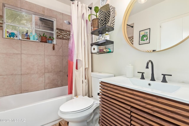 full bath featuring vanity, toilet, and shower / tub combo with curtain