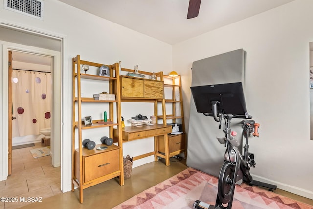 home office with visible vents, baseboards, and a ceiling fan