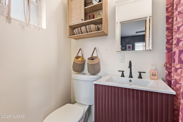 bathroom with vanity and toilet