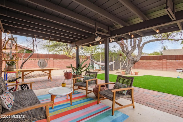 view of patio with a fenced backyard and an outdoor hangout area