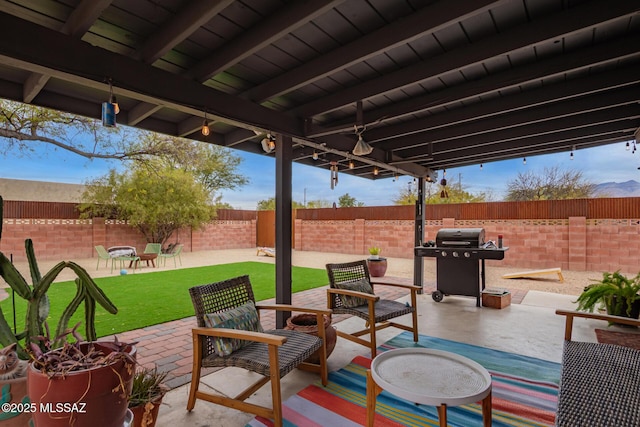 view of patio with a fenced backyard and grilling area