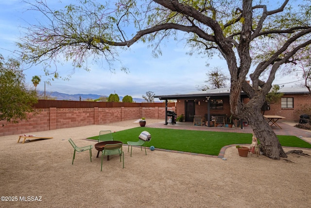 view of yard featuring a patio and fence