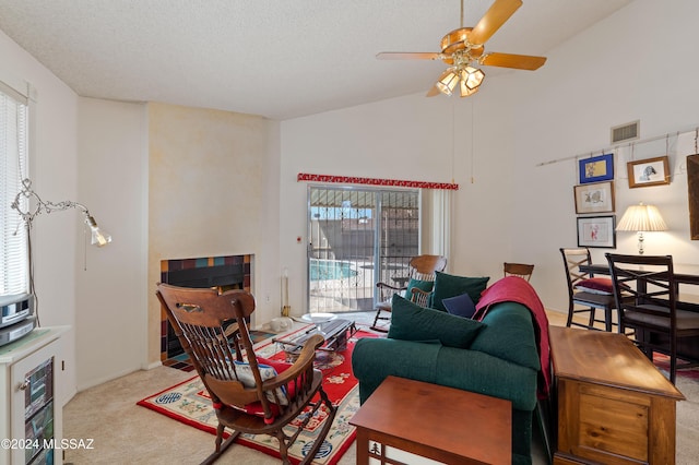 living area featuring a textured ceiling, high vaulted ceiling, carpet flooring, and visible vents