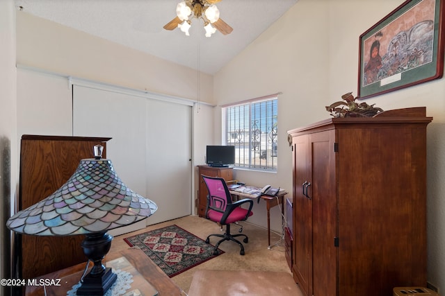 office featuring lofted ceiling, carpet, and ceiling fan