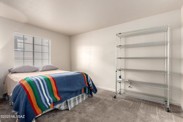 carpeted bedroom with baseboards