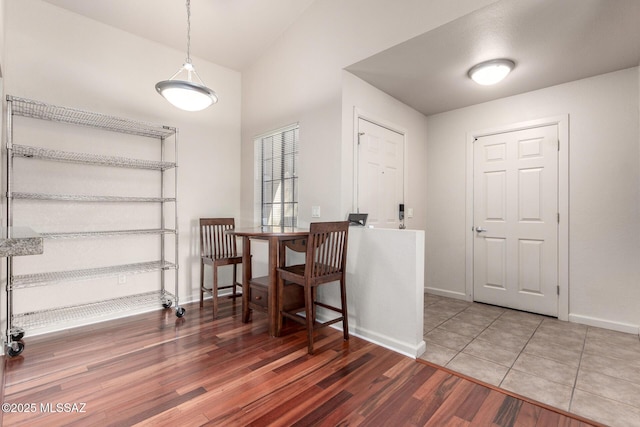 dining area with wood finished floors and baseboards
