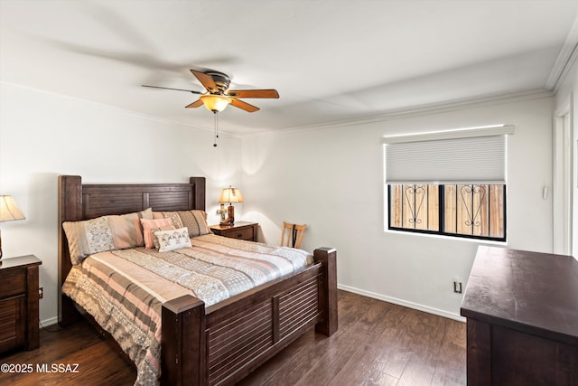 bedroom featuring baseboards, a ceiling fan, dark wood-style floors, and crown molding