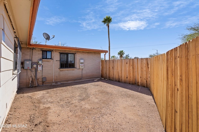 view of yard featuring a patio area and a fenced backyard