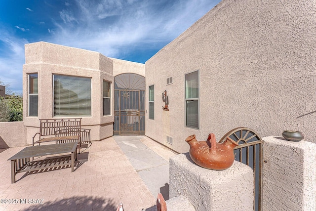 view of patio featuring visible vents