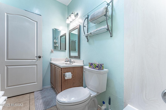 full bath featuring toilet, tile patterned floors, and vanity