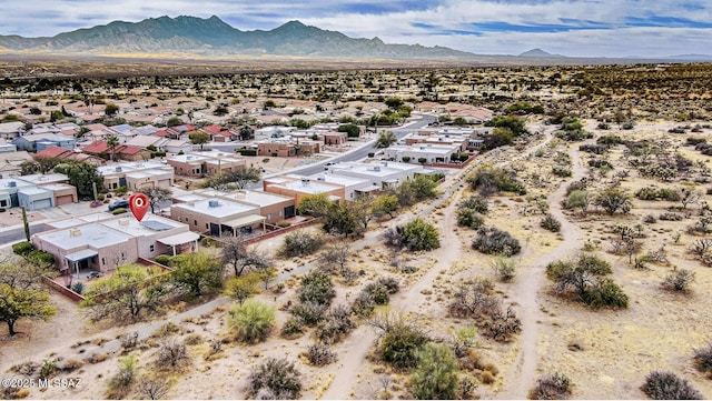 bird's eye view featuring a residential view, a desert view, and a mountain view