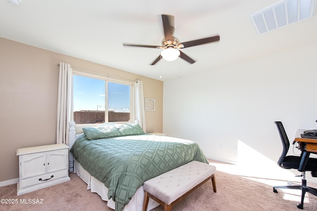 bedroom featuring light carpet, visible vents, and a ceiling fan