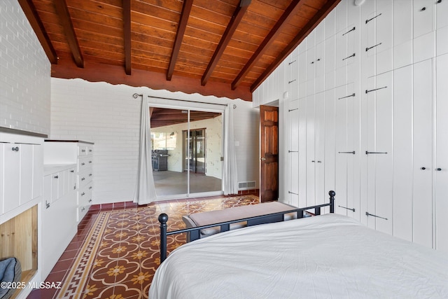 tiled bedroom with visible vents, brick wall, vaulted ceiling with beams, access to exterior, and wooden ceiling