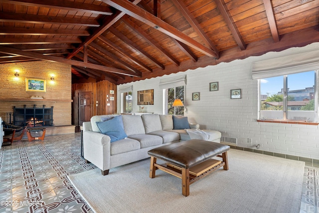 living room with wooden ceiling, vaulted ceiling with beams, visible vents, and a large fireplace