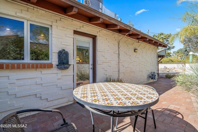 view of patio / terrace featuring outdoor dining area and fence