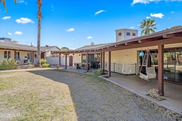 back of house with a patio