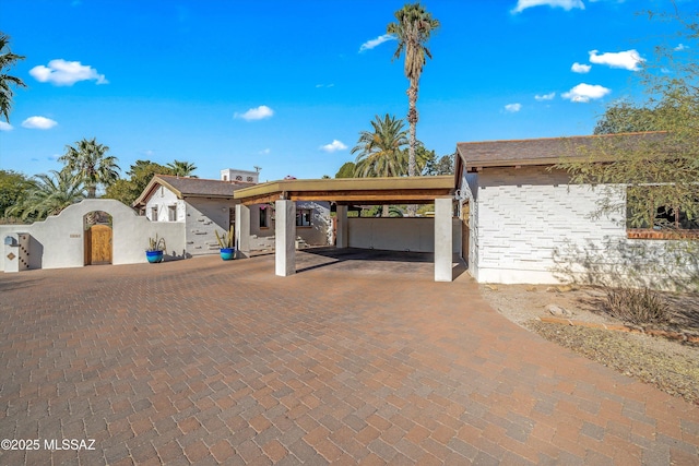 view of front of property with a gate