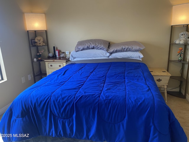 tiled bedroom with baseboards